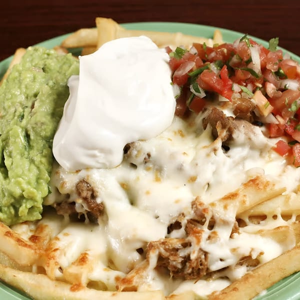 Sancho's Taqueria's carne asada fries with guacamole, sour cream, and pico de gallo.