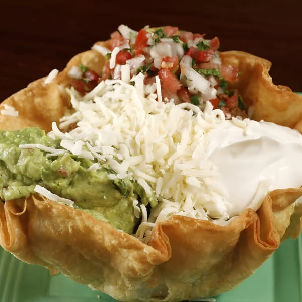 Sancho's Taqueria taco salad in a crispy shell with guacamole, cheese, sour cream, and pico de gallo.