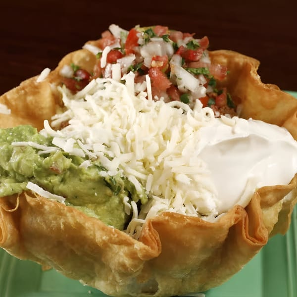 Sancho's Taqueria taco salad in a crispy shell with guacamole, sour cream, cheese, and pico de gallo.